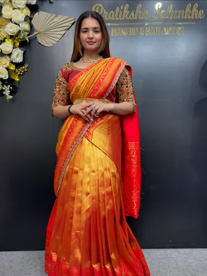A confident pose in the half-saree, showing how the drape allows for easy and stylish movement.