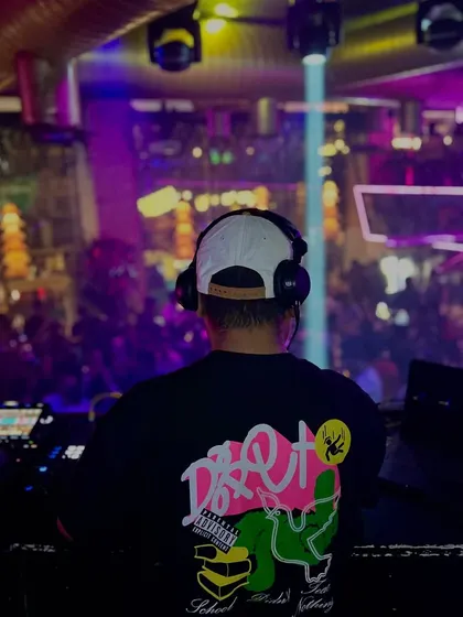Fuel to your fire. A shot from behind the console, looking out at a packed venue. My mission is to ignite the dance floor.