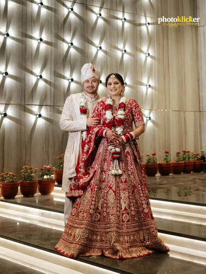 A classic portrait of the bride and groom in their stunning wedding attire. We ensure we capture these essential, timeless shots for your album. (Note: These are duplicate images).
