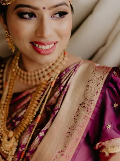 Those eyes and her smile paint a beautiful picture. A close-up of a happy bride, her joy radiating through her flawless makeup.