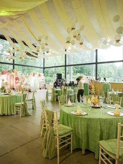 Another view of the event space, showing how the soft ceiling drapes and hanging lanterns created a sense of intimacy and magic within the large, open room.