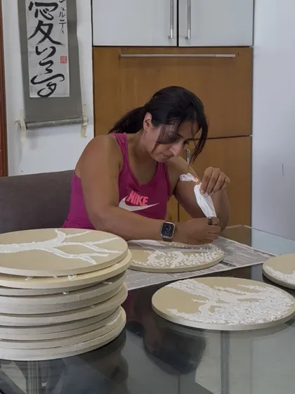A wider shot of me working on the stack of circular canvases for the Diwali collection.