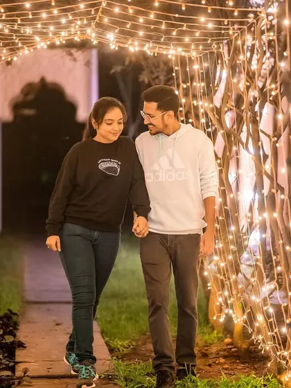 A beautiful, romantic stroll through a magical tunnel made of branches and fairy lights.