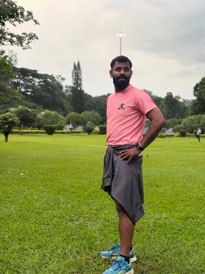 A candid shot of me in the park, taking a moment after a run.