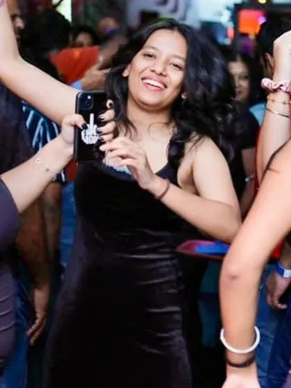 A candid shot of someone lost in the music on the dance floor. This is the pure joy I aim to create.