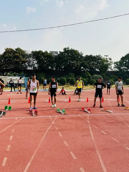 At the starting line, anticipation brims as athletes get ready for the race.