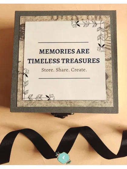 The outside of our Magical Memory Box, featuring the quote "Memories are timeless treasures." This elegant wooden box is designed to hold a cascading series of photos, making it a gift that's as beautiful closed as it is open.
