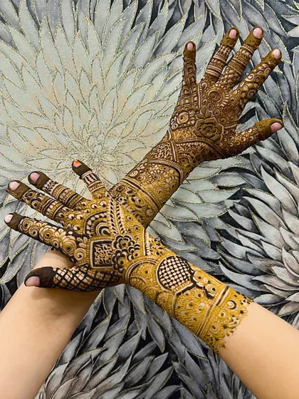 A crossed-hands pose highlighting the beautiful flow and symmetry of the design.