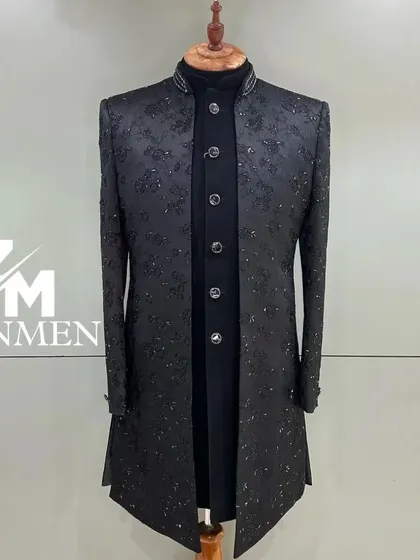 A timeless black Indo-Western sherwani with subtle, all-over floral embroidery in a tonal thread. A classic and elegant choice for any formal occasion.