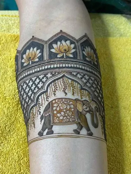 A close-up of an elephant motif, beautifully detailed under a canopy of lotus flowers. I pay close attention to these small elements to make your design special.