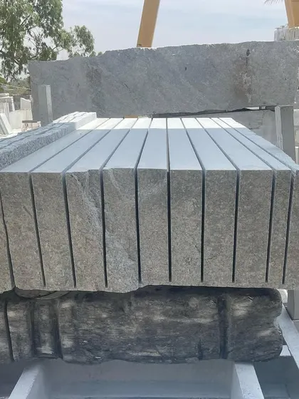 A large block of granite after being cut into multiple slabs by the gang saw.