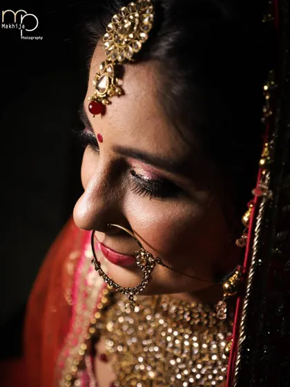 A detailed close-up of the bride, focusing on her intricate nath (nose ring) and maang tikka. I make sure to capture these small but significant details of the bridal look.