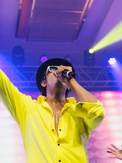 Reaching for the high notes. A live performance is about capturing the raw emotion of the music.
