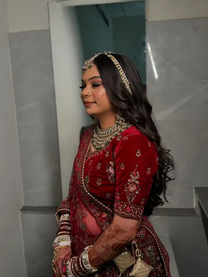 A close-up of my bride Nidhi in her velvet wedding lehenga. The soft, wavy hair left open is a modern touch to her otherwise traditional look.