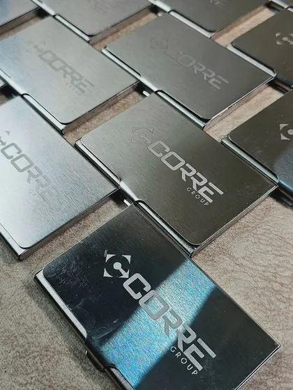 Duplicate of 57. A closer look at the engraved metal card holders, showing the clean and precise logo application.