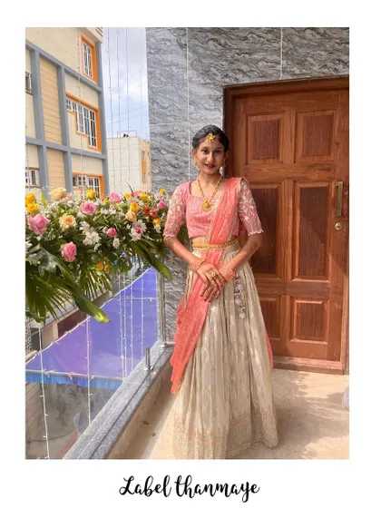 A beautiful lehenga in peach and off-white, perfect for weddings and functions. The blouse has delicate embroidery.