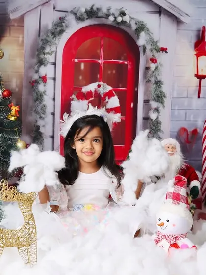 A full view of the magical Christmas setup for an older child, complete with a decorated tree and a snowy landscape.