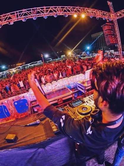 A fisheye perspective of the madness. This wide-angle shot captures us, the decks, and the massive, energetic crowd all in one frame.