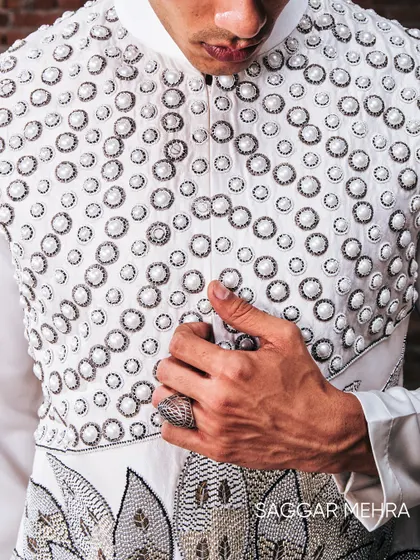 The pearl lotus motif, a symbol of power and purity, brought to life with intricate hand-embroidery on a modern Indian silhouette. This detail shot shows the fusion of traditional symbolism with contemporary couture techniques, a hallmark of my work.