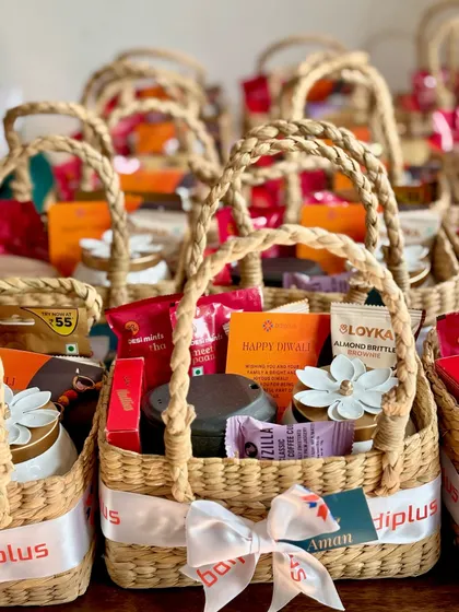 We love creating custom bulk orders for corporate Diwali gifting! These pretty cane baskets were filled with a tumbler, a jar candle, a lotus tealight holder, and a variety of tasty snacks.