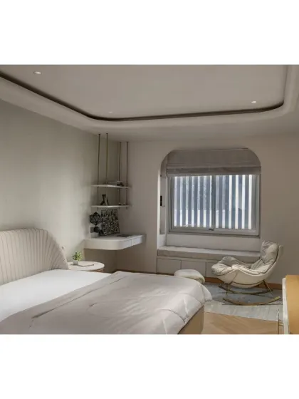 The second daughter's bedroom in the Slender House has a more serene, minimalist aesthetic. A cozy reading nook by the arched window and a clean, white palette create a calm and personal space.