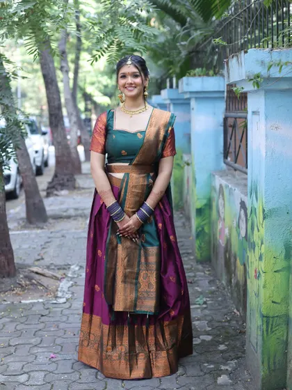 A smiling portrait. The client looks happy and beautiful in her traditional attire.
