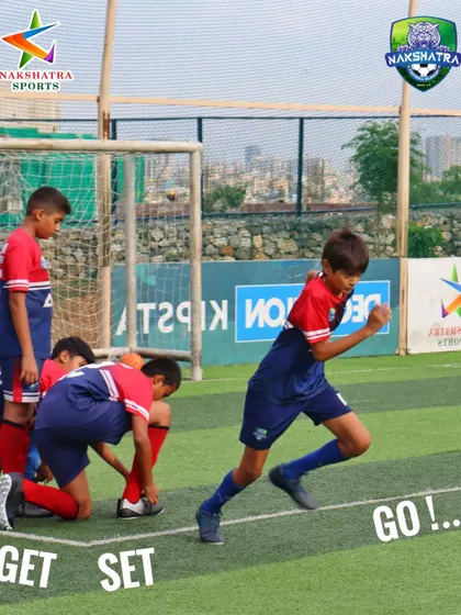 Get set, go. A young player sprints into action, showing the explosive energy we build during our warm-ups and drills.