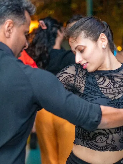A focused and intense moment during a Bachata dance.