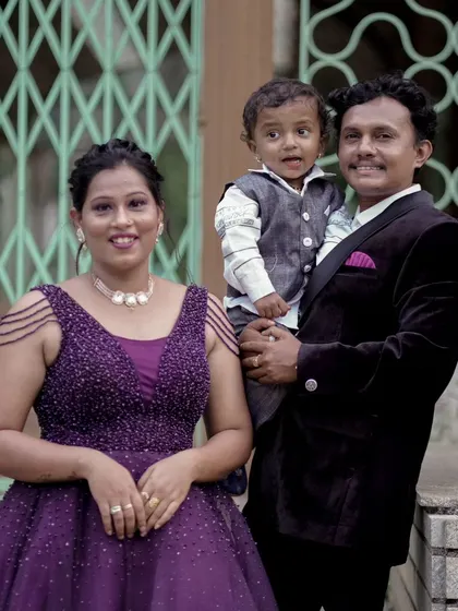 An identical shot of the family in purple, capturing a warm and happy moment together.