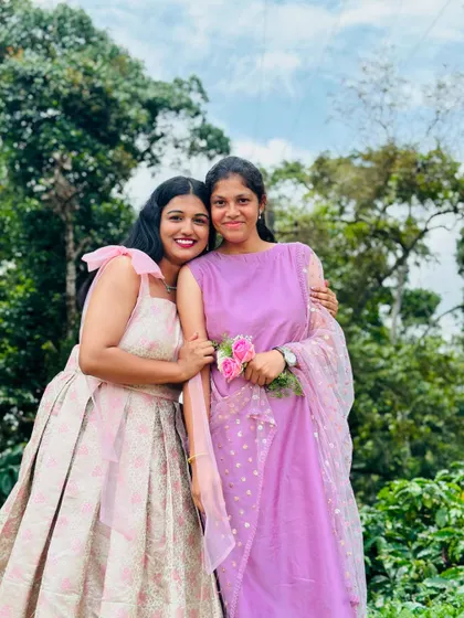 Sisters in custom outfits. It's always a pleasure to design for the whole family and see them celebrate together.