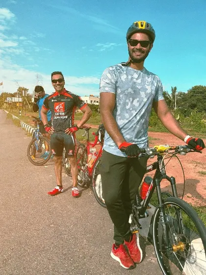 Posing with my bike during a group ride. Leading by example is a core part of my coaching philosophy.