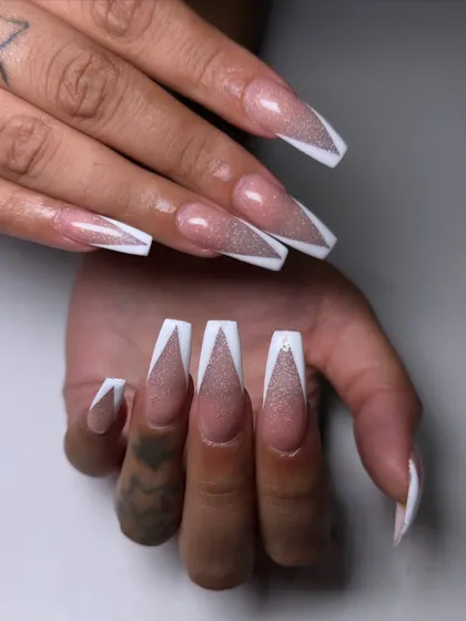 I took the classic V-French and gave it a party-ready upgrade. This set features a glittery cat eye base under sharp, clean white tips for a dramatic effect.