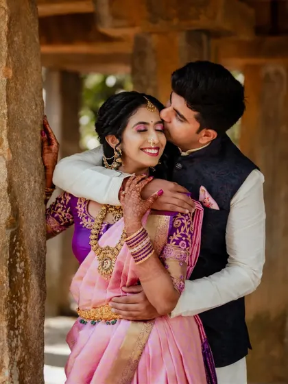 A sweet embrace amidst the marigold decor. We captured this candid moment between the couple on a swing, showcasing their playful connection during their wedding celebrations at The Tamarind Tree.