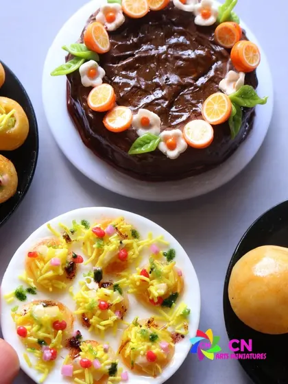 A close-up of the chaat miniatures, showing the intricate details of the pani puri and dahi puri.