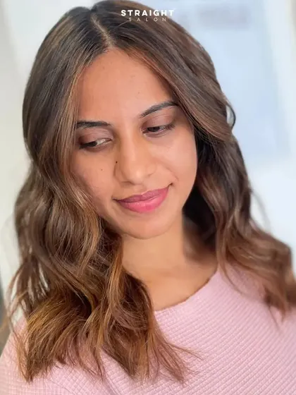 A portrait of the happy client, her hair perfectly framing her face.