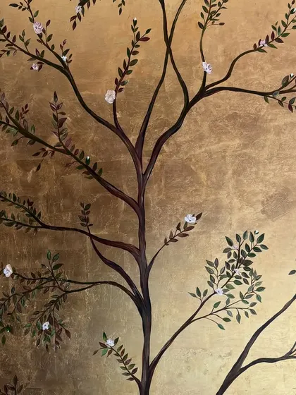 A full view of the hand-painted tree on the shimmering gold leaf background. I designed the branches to feel both delicate and expansive, filling the vertical space of the wall panel.