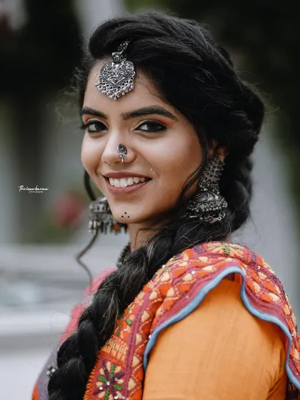 A joyful portrait featuring vibrant, traditional Indian attire and stunning silver jewelry. This image highlights my skill in capturing bright, happy expressions and rich cultural details.