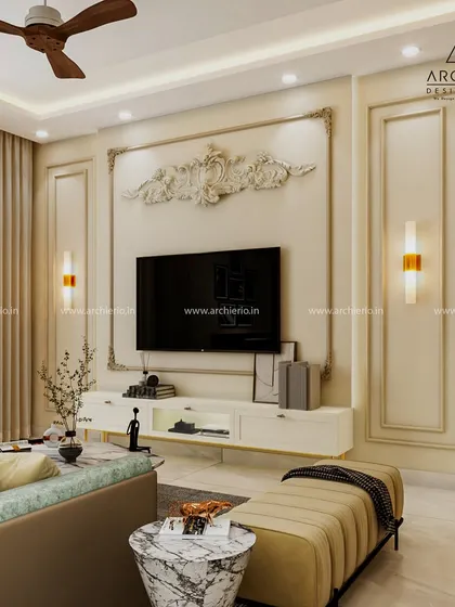 This living room showcases classic European elegance with ornate wall mouldings and a statement art piece above the TV. The design is timeless, clean, and luxurious.