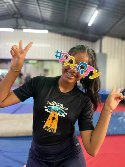 Double peace signs for a double dose of fun. This student is all about bringing good energy to the party.