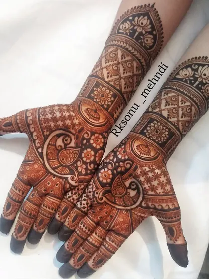 A beautiful semi-bridal design that balances intricate patterns with open space. This theme-based art features peacocks and lotus motifs, perfect for any wedding celebration.