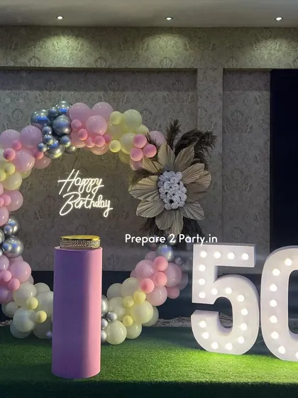 My 50th birthday decorations are designed to be tasteful and celebratory. I offer both floral-heavy designs and modern balloon arrangements to honor this golden milestone.
