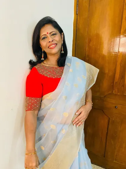 A smile in my light grey organza saree. It's so easy to wear, yet feels so elegant, making it one of my go-to choices for festive gatherings.