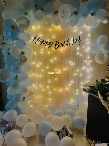 The same setup before the table was arranged, showing the beautiful balloon and light backdrop on its own.