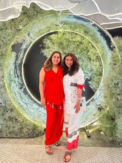 Standing in front of one of our creations. The Doli Diary isn't just the company we built; it's the life we built, together. We are so proud of our team and the incredible celebrations we get to be a part of.
