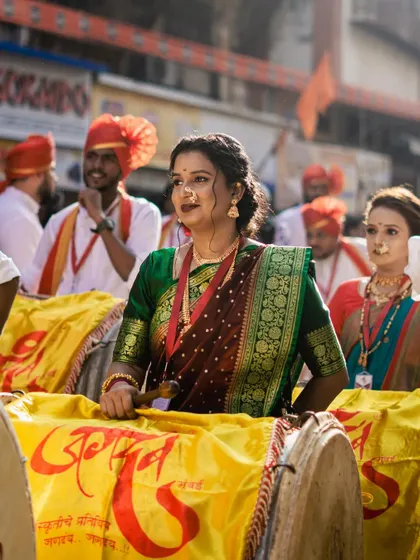 A collection of portraits from the Gudi Padwa parade in Girgaon. The series showcases women in stunning traditional attire, playing dhols and riding motorcycles, blending tradition with modernity.