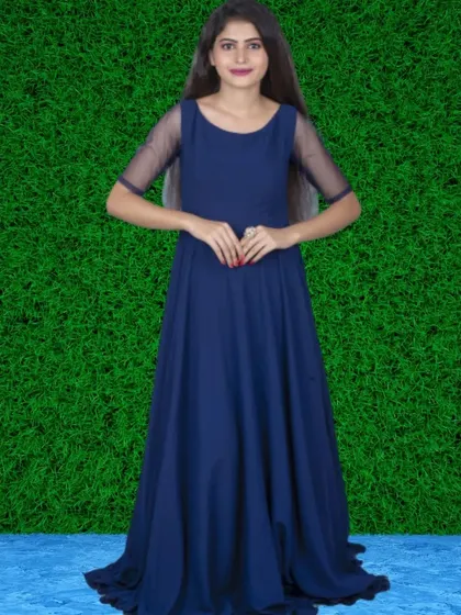 A classic navy blue gown with sheer short sleeves. This is a versatile and elegant option that works well for many different events.