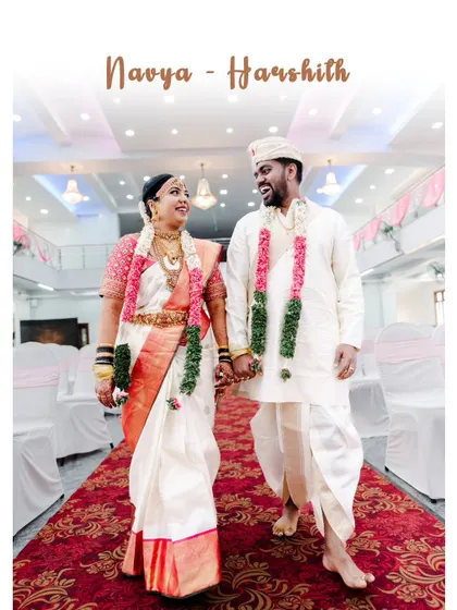 A classic, happy portrait of a newly married couple walking down the aisle, hand in hand.