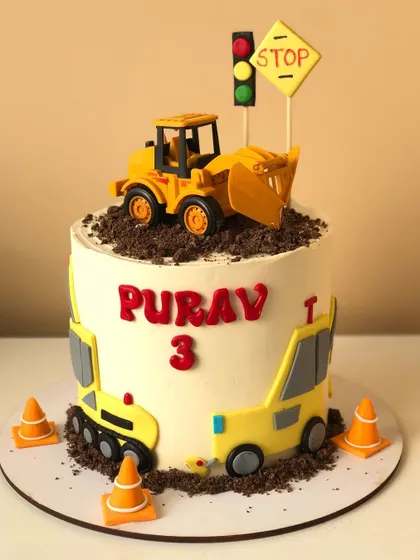 A construction-themed cake with a bulldozer topper, traffic signs, and chocolate cookie "dirt."