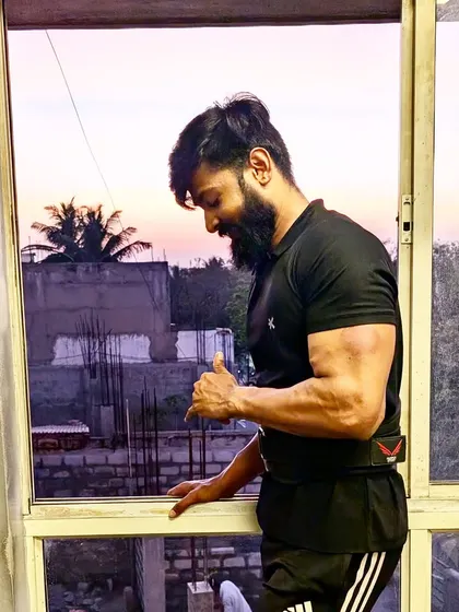"Biceps today, stronger tomorrow." A side bicep flex, showing the definition and size.