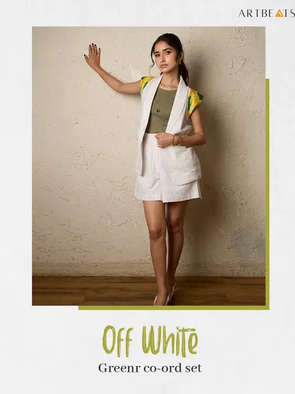 The Off-White Greener co-ord set. The art-detailed shoulders add a pop of color to the neutral, striped fabric, making it an elevated essential.